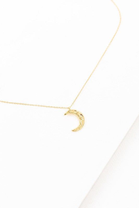 Crescent Moon Hammered Necklace on a delicate chain against a white background.