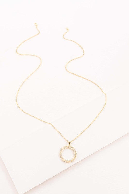 Sol Pendant Necklace with circular pendant and lobster clasp on a white background.