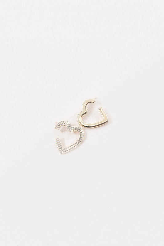 A Pair of Hearts Earrings with a dangling rhinestone detail and 14k Gold Plating on a white background.