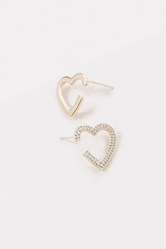 A Pair of Hearts Earrings with a dangling rhinestone detail and 14k Gold Plating on a white background.