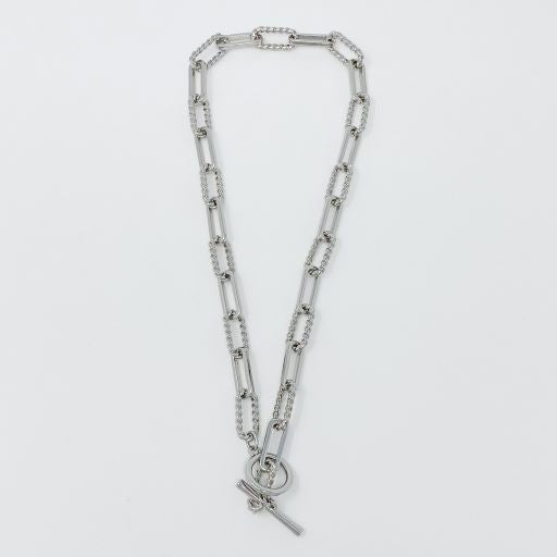 Two Toggle Chain Link Necklaces against a white background, one gold-plated and one silver-toned, each with a toggle clasp closure.