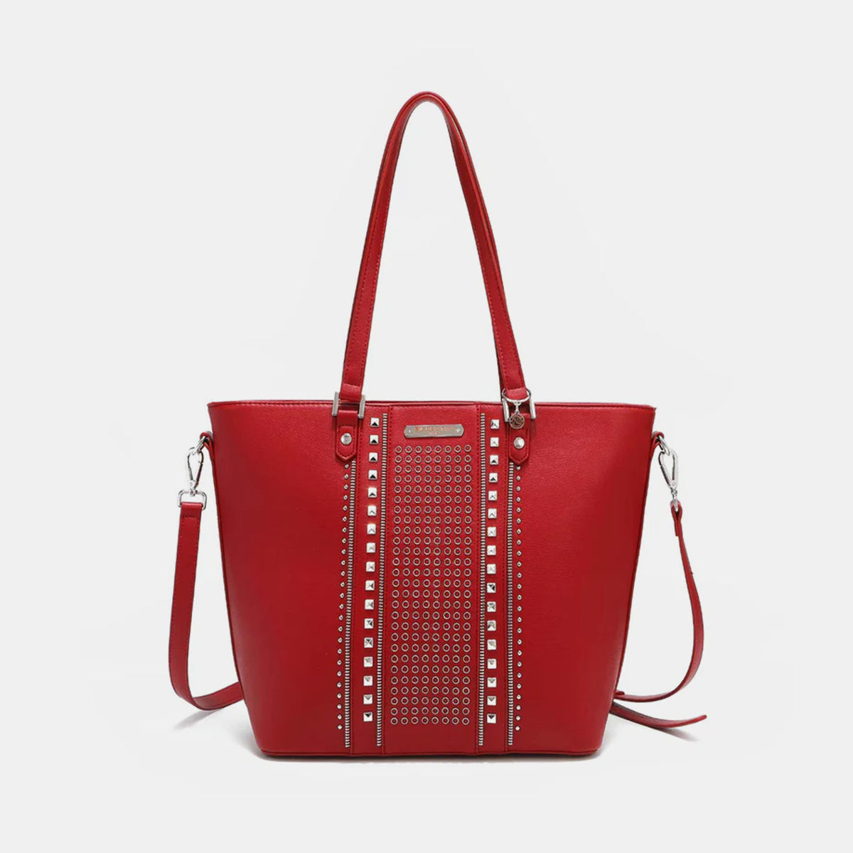 The Nicole Lee USA Studded Decor Tote Bag boasts a trendy appeal with its vegan leather material, highlighted by silver studs and dual shoulder straps, showcased against a white background.