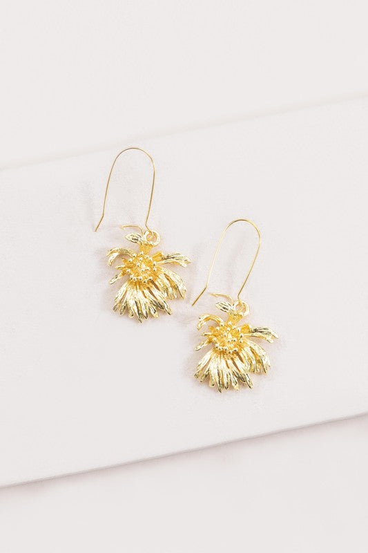 Experience the elegance of spring jewelry with the Wilted Chrysanthemum Hook Earrings, meticulously crafted and 14k gold plated, as they rest gracefully on a white surface.