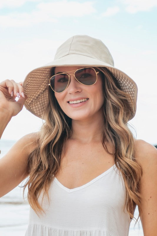 Woman wearing a wide-brimmed Bow Accent Cargo Hat at the beach.