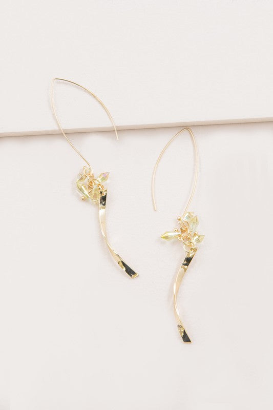 The Twist Arc Threader Earrings boast a graceful design with a curved shape and delicate crystal accents.