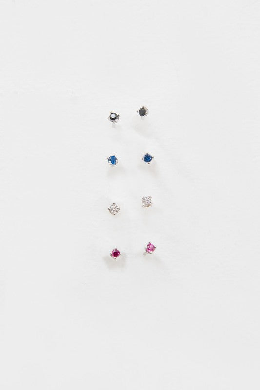 A collection of six pairs of Dainty Stud Stone Earrings displayed on a white background, showcasing hypoallergenic designs with sterling silver accents, adorned with stones in blue, pink, and clear hues.