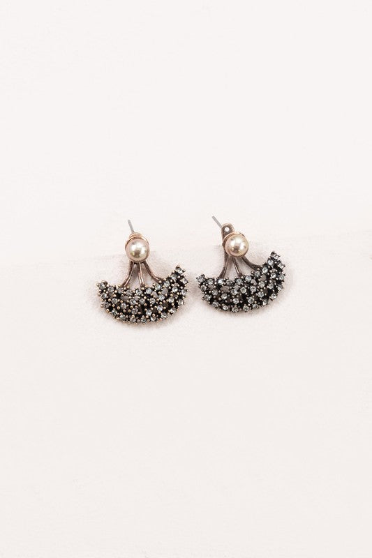 A pair of Couture Ear Jacket Earrings against a white background.