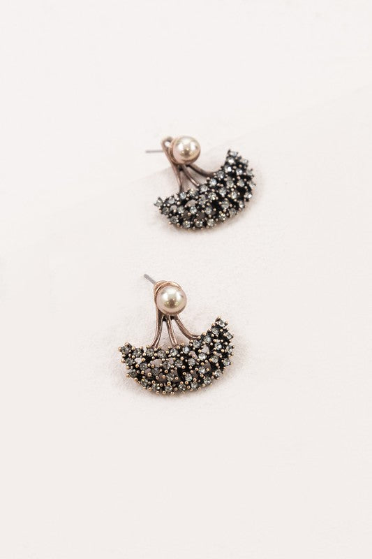 A pair of Couture Ear Jacket Earrings against a white background.
