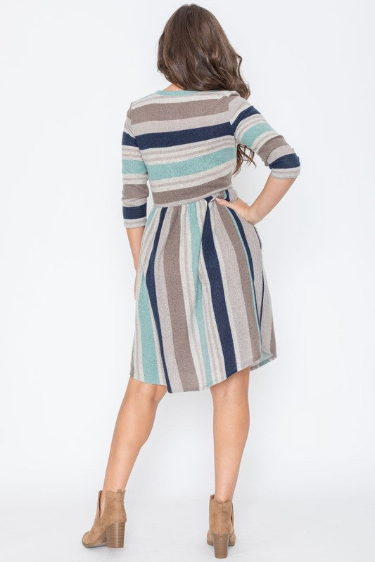 Dressed elegantly in the striking Stripe Curved Hem Midi Dress, crafted from a polyester-spandex blend, an individual stands against a pure white backdrop.