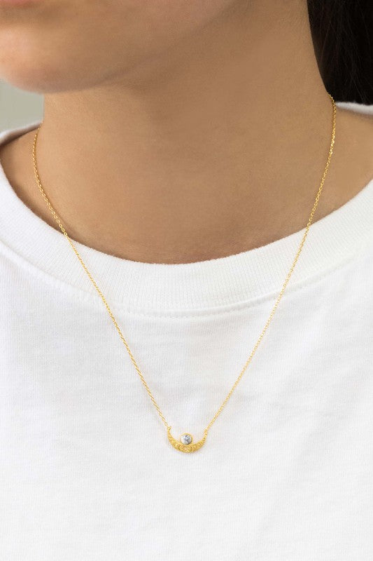 The Rumi Stone Necklace collection showcases five Bohemian-style stone and gold necklaces with crescent-shaped pendants, each adorned with a uniquely colored stone, beautifully displayed on a white background.