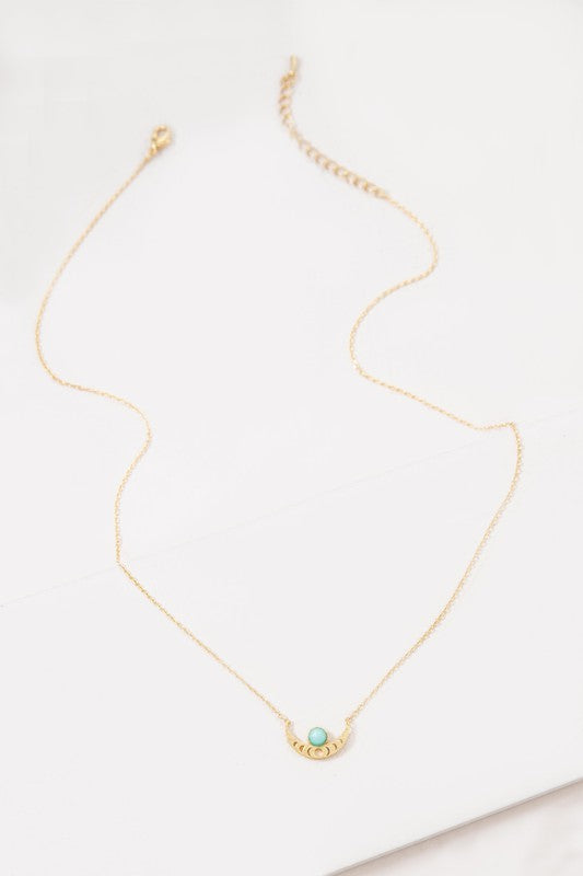 The Rumi Stone Necklace collection showcases five Bohemian-style stone and gold necklaces with crescent-shaped pendants, each adorned with a uniquely colored stone, beautifully displayed on a white background.