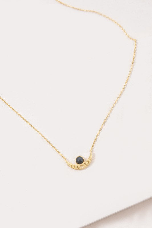 The Rumi Stone Necklace collection showcases five Bohemian-style stone and gold necklaces with crescent-shaped pendants, each adorned with a uniquely colored stone, beautifully displayed on a white background.