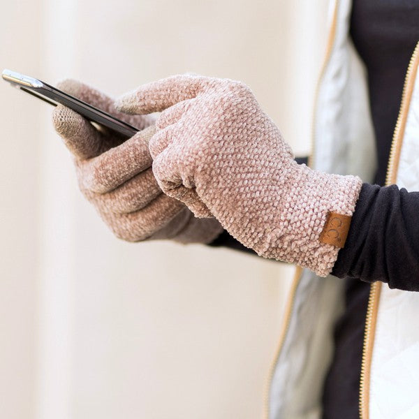 A person wearing a white jacket and gray CC Chenille Touch Gloves using a smartphone.