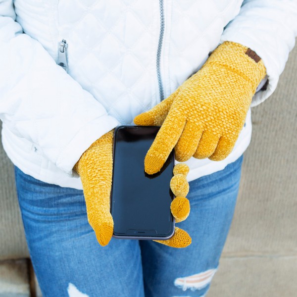 A person wearing a white jacket and gray CC Chenille Touch Gloves using a smartphone.