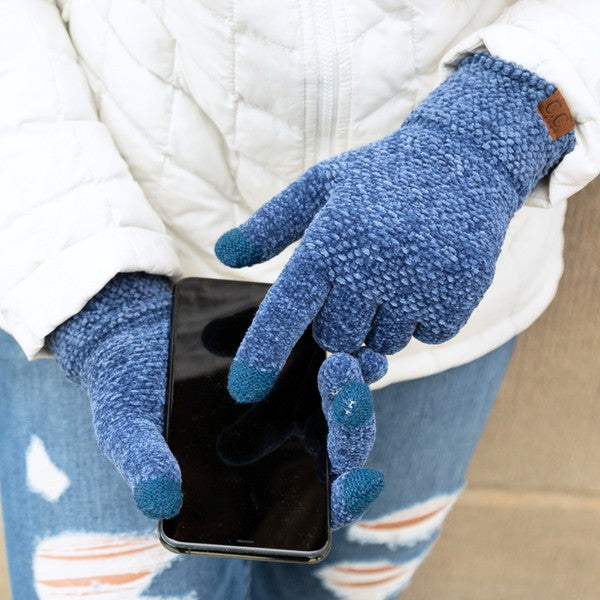 A person wearing a white jacket and gray CC Chenille Touch Gloves using a smartphone.