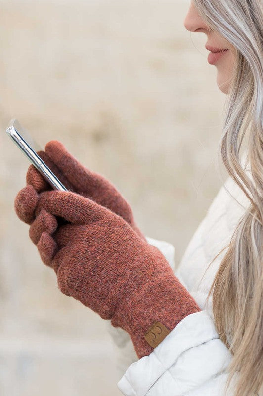 Person wearing CC Cashmere Blend Touch Gloves holding a smartphone to their ear.