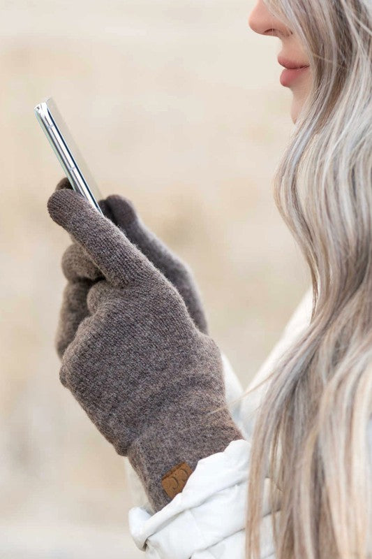 Person wearing CC Cashmere Blend Touch Gloves holding a smartphone to their ear.