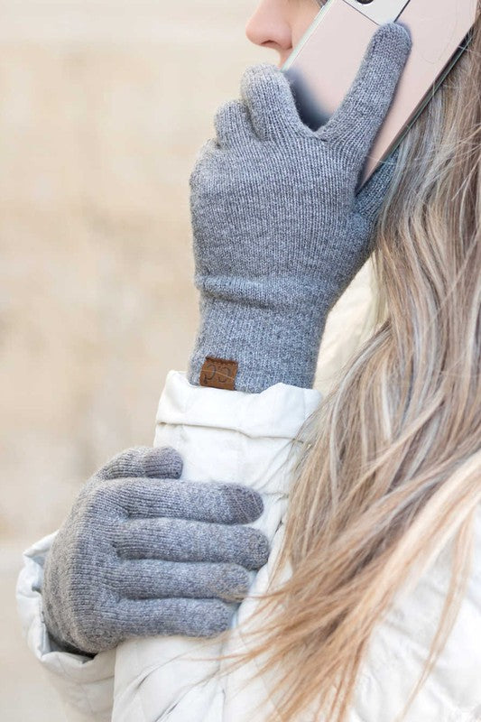 Person wearing CC Cashmere Blend Touch Gloves holding a smartphone to their ear.