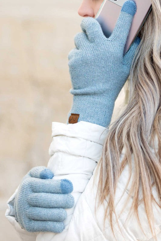 Person wearing CC Cashmere Blend Touch Gloves holding a smartphone to their ear.