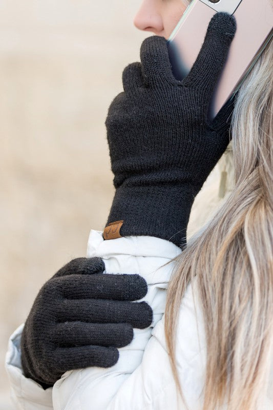 Person wearing CC Cashmere Blend Touch Gloves holding a smartphone to their ear.