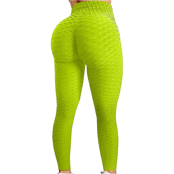 A person wearing bright green textured Yoga Pants stands with their back facing the camera.