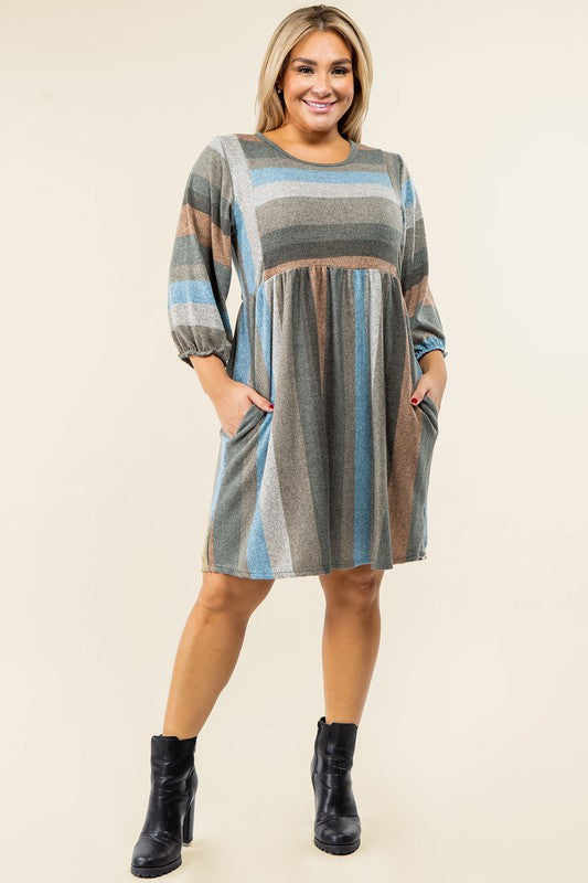 A person stands smiling, dressed in a Mix Stripe Balloon Sleeve Midi Dress that features multi-colored horizontal stripes in shades of blue, brown, and gray. The midi dress, crafted from polyester, includes three-quarter sleeves and handy pockets.