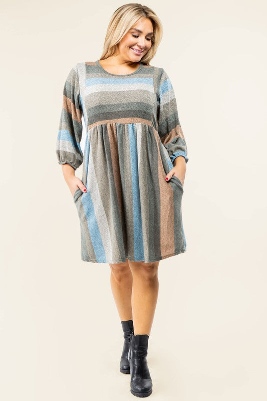 A person stands smiling, dressed in a Mix Stripe Balloon Sleeve Midi Dress that features multi-colored horizontal stripes in shades of blue, brown, and gray. The midi dress, crafted from polyester, includes three-quarter sleeves and handy pockets.