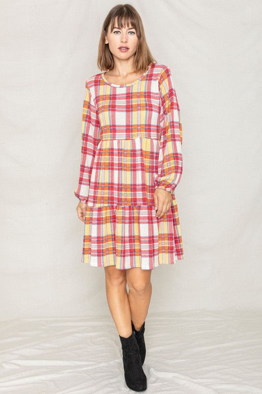 A person is wearing the Plaid Balloon Sleeve Tiered Midi Dress in red, yellow, and white, standing against a light background.