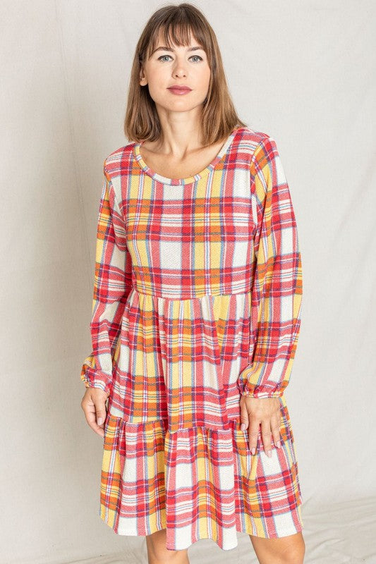 A person is wearing the Plaid Balloon Sleeve Tiered Midi Dress in red, yellow, and white, standing against a light background.