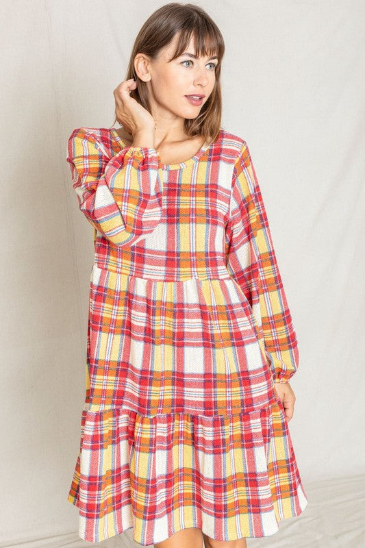 A person is wearing the Plaid Balloon Sleeve Tiered Midi Dress in red, yellow, and white, standing against a light background.