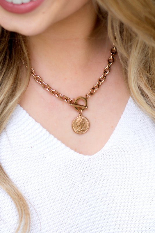 A close-up of a woman wearing a Coin Accent Chain Necklace.
