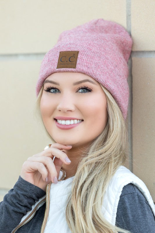 Woman smiling while wearing a CC Heathered Boyfriend Beanie.