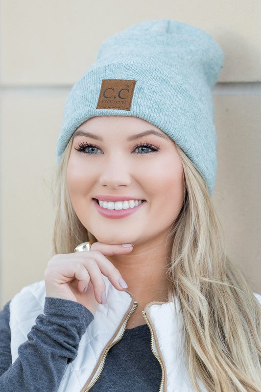 Woman smiling while wearing a CC Heathered Boyfriend Beanie.