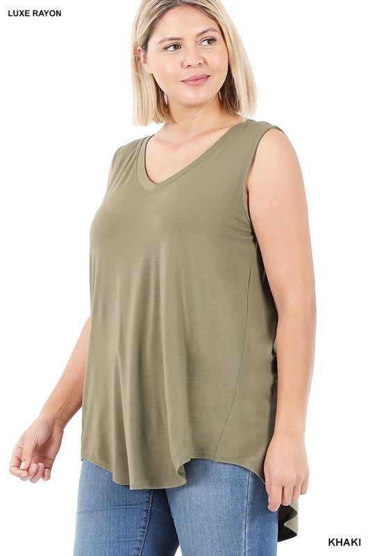 A woman wearing a Plus Luxe Rayon Sleeveless V-Neck Hi-Low Hem Top and blue jeans looks to the side. The top boasts a slight asymmetrical hem. Tags on the image say “Plus Luxe Rayon Sleeveless V-Neck Hi-Low Hem Top” and “Khaki.”