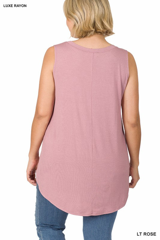 A woman wearing a Plus Luxe Rayon Sleeveless V-Neck Hi-Low Hem Top and blue jeans looks to the side. The top boasts a slight asymmetrical hem. Tags on the image say “Plus Luxe Rayon Sleeveless V-Neck Hi-Low Hem Top” and “Khaki.”