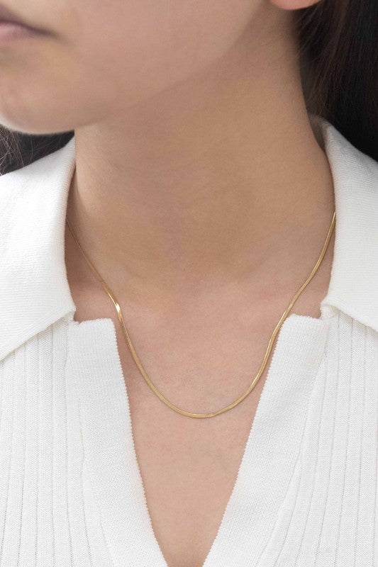 Two Snake Chain Necklaces, 14k gold plated with simple chain links, made from durable stainless steel, are laid flat on a white background.