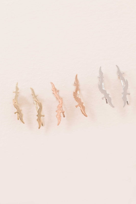 Three pairs of Love Bird Ear Pin Earrings, elegantly designed in gold, rose gold, and silver tones, showcased beautifully on a light background.