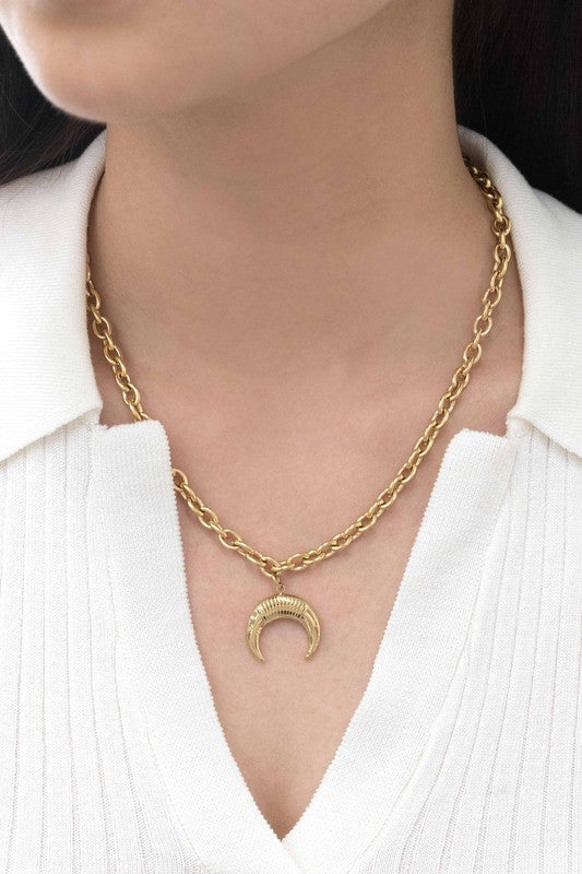 Wild West Double Horn Necklace, a 14k gold plated piece with a crescent-shaped pendant, elegantly displayed on a light background.