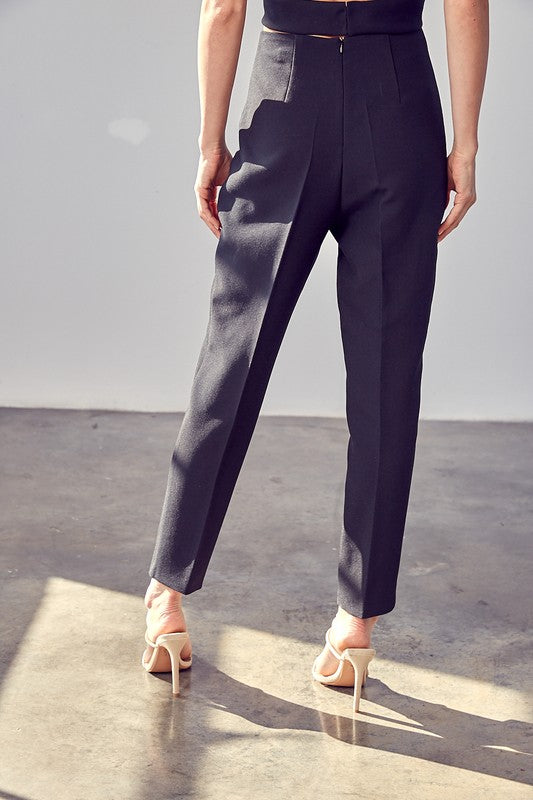 A woman wearing the High Waisted Slim Pants.