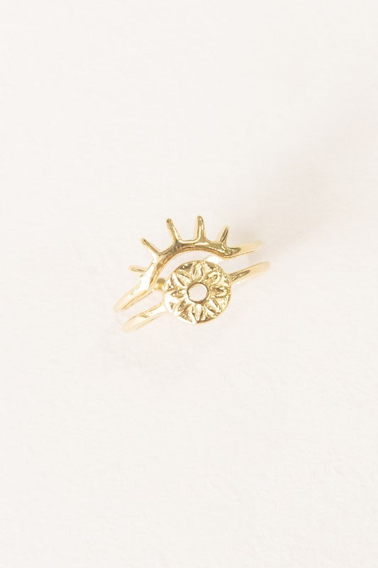 The Eye of the Beholder Adjustable Ring showcases a gold open band design decorated with a sun motif, capturing the spirit of bohemian jewelry.