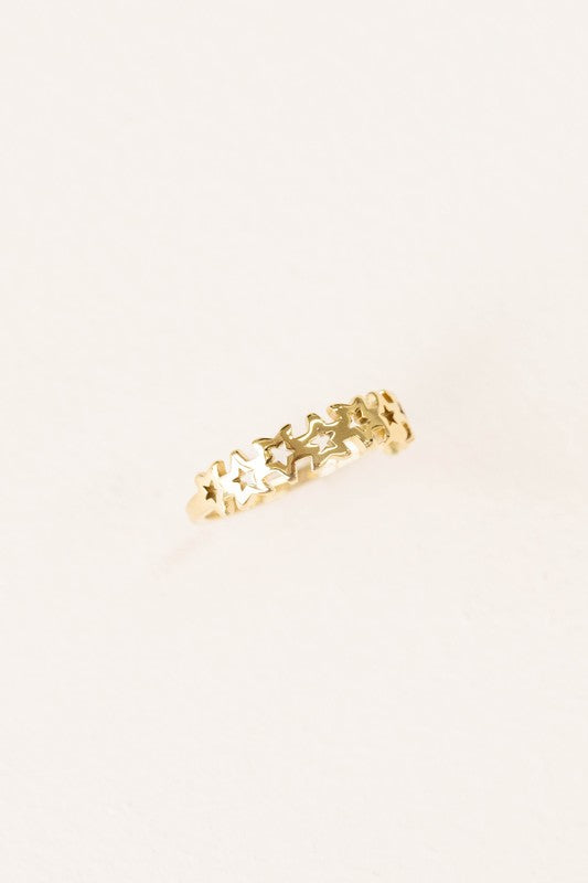 The You're a Star Ring boasts an intricate design of interlinked stars on a subtle background, beautifully crafted from stainless steel and accented with 14k gold plating.