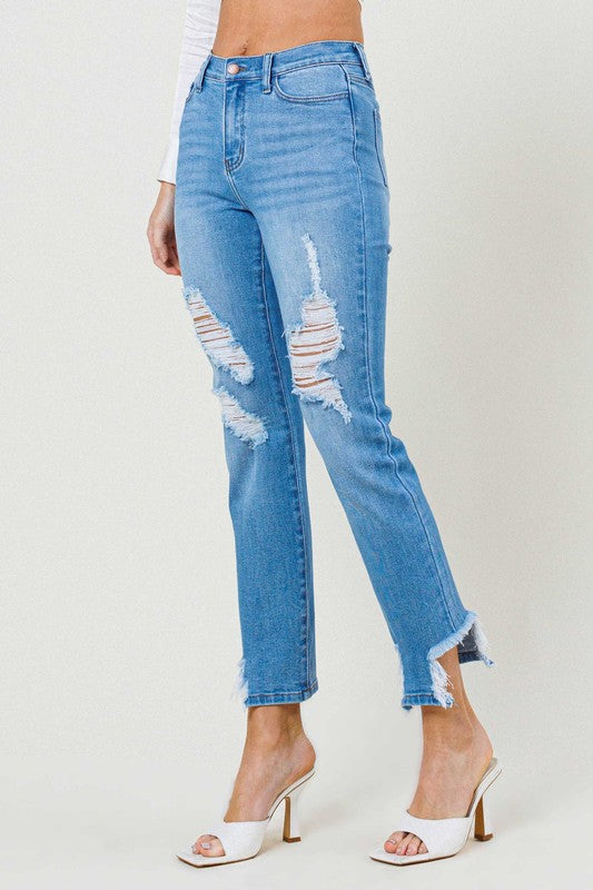 Person wearing light blue Mid Rise Straight Leg jeans with distressed details and white open-toe heels.