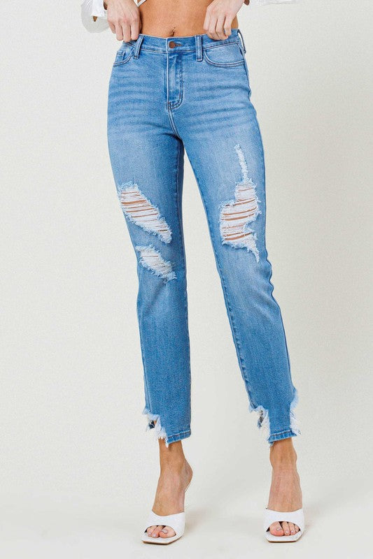 Person wearing light blue Mid Rise Straight Leg jeans with distressed details and white open-toe heels.