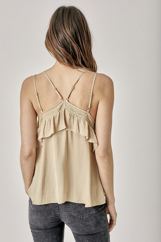 A woman wearing a white Trim Detail with Ruffle Cami Top paired with a purple tie-dye skirt poses against a plain background—an ideal choice for enhancing your summer wardrobe.