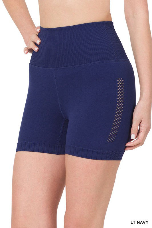Seamless high-waisted workout shorts with perforated side detail on a female mannequin.