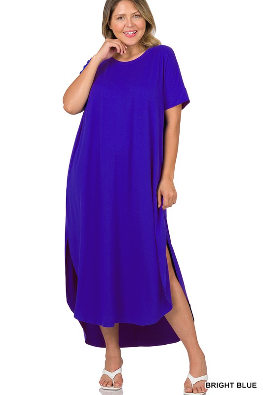 A person wearing the Plus Brushed DTY Short Sleeve Maxi Dress, featuring a vibrant blue color with slits on both sides and a subtle brushed DTY texture, stands in front of a plain white background.