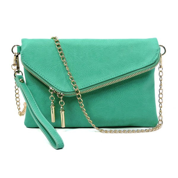 The Fashion Envelope Foldover Clutch is a green accessory with a gold chain strap and zipper detail, enhanced by a wristlet attachment and tassels. Made from faux leather, it comes with a detachable shoulder strap for versatile styling options.