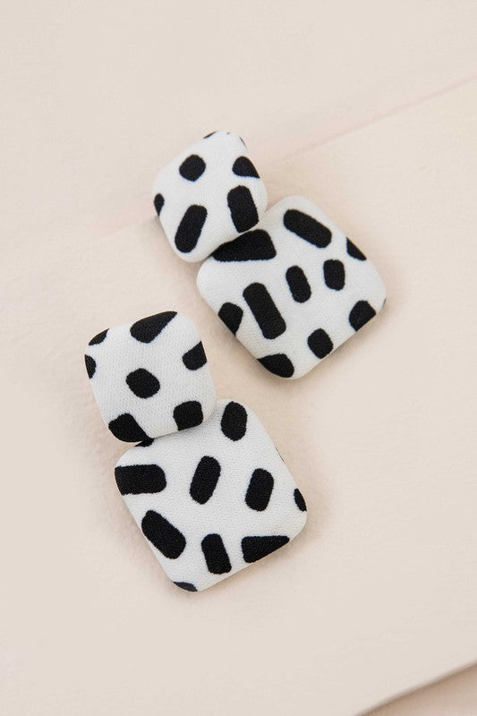 Textile Drop Earrings with a retro design featuring a black and white checkered pattern on a beige background.