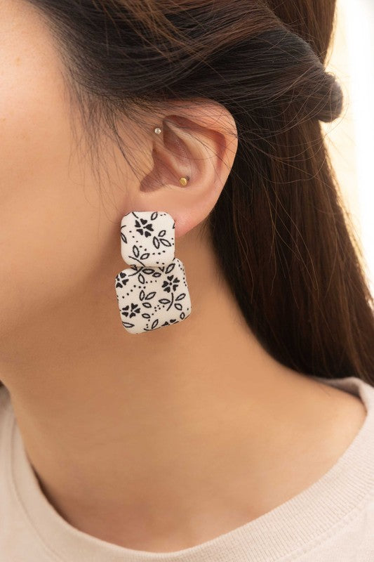 Textile Drop Earrings with a retro design featuring a black and white checkered pattern on a beige background.