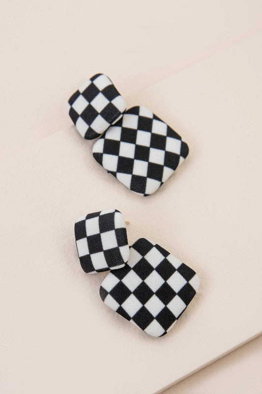 Textile Drop Earrings with a retro design featuring a black and white checkered pattern on a beige background.